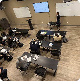 Lecture room filled with technicians in active session